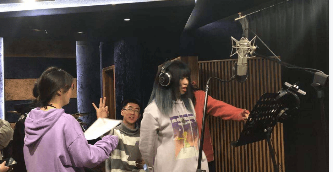 Meisheng team working in a recording studio